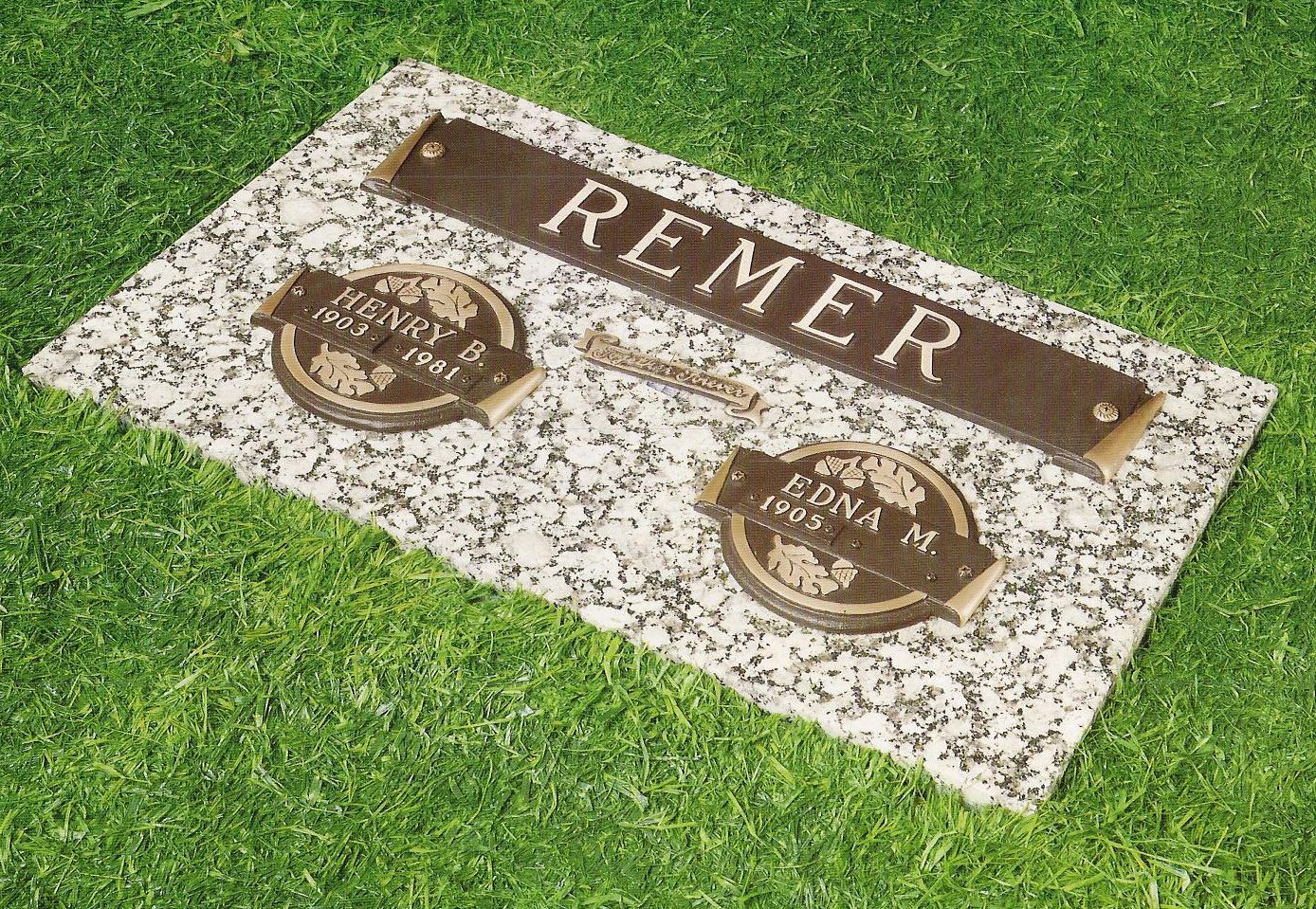 In-ground cremation marker with bronze accessories