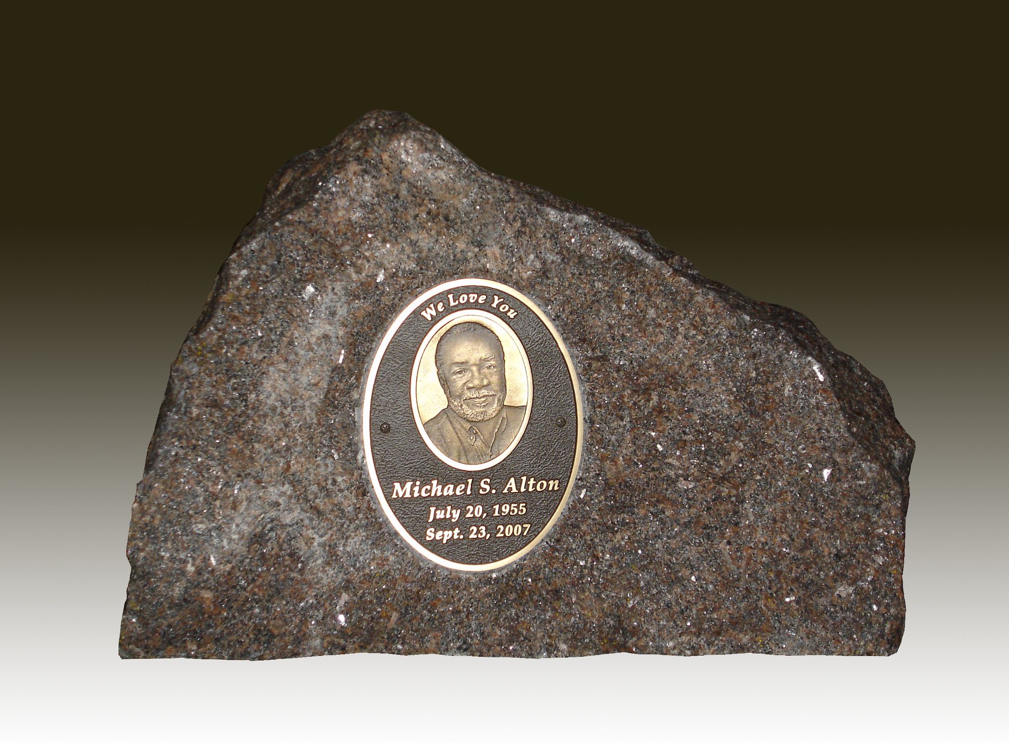 Stone cremation marker with bronze plaque